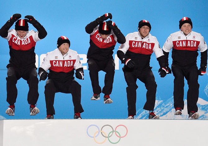 (From left) Gold medalists Brad Jacobs, Ryan Fry, EJ Harnden, Ryan Harnden and Caleb Flaxey of Canada celebrate during the medal ceremony for Men's Curling.