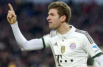 Bayern Munich's Thomas Mueller celebrates after scoring during the German Bundesliga match against Hanover 96 in Hanover on Sunday