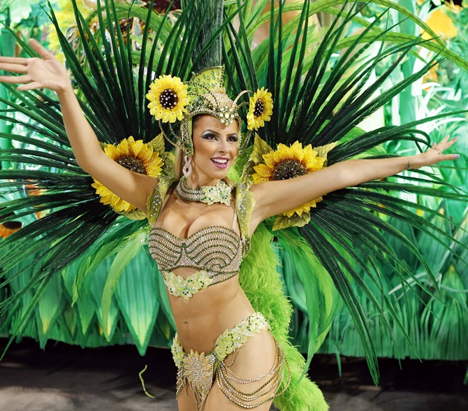 A reveller from the Vila Isabel samba school participates in the annual Carnival parade in Rio de Janeiro.