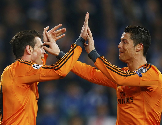 Real Madrid's Gareth Bale, left, and Cristiano Ronaldo celebrate Bale's goal against Schalke 04.