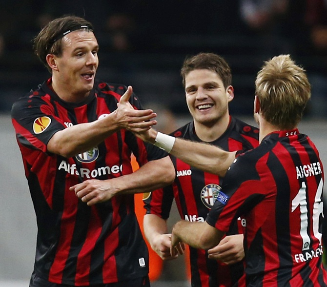 Eintracht Frankfurt's Alexander Meier,left, and Stefan Aigner celebrate Meier's goal against Porto.