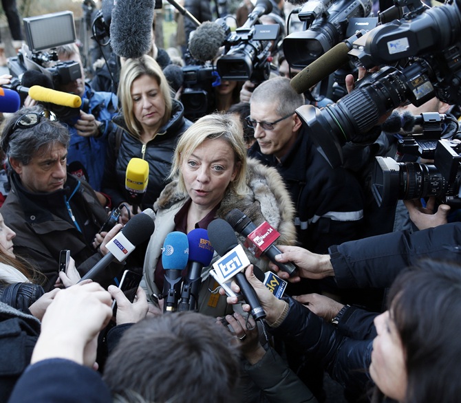 Sabine Kehm (centre), agent for Michael Schumacher, talks to journalists