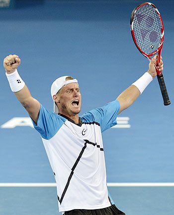 Lleyton Hewitt of Australia celebrates after defeating Roger Federer of Switzerland in the final of the Brisbane International at Queensland Tennis Centre on Sunday