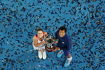 Alize Cornet and Jo-Wilfried Tsonga of France pose with the Hopman Cup trophy after defeating Agnieszka Radwanska and Grzegorz Panfil of Poland in the final on day eight of the Hopman Cup at Perth Arena on Saturday