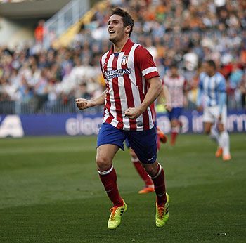 Atletico Madrid's Koke celebrates after scoring a goal against Malaga during their Spanish First Division soccer match at La Rosaleda stadium in Malaga on Saturday