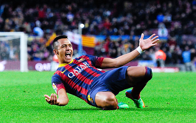 Alexis Sanchez of FC Barcelona celebrates after scoring his team's fourth goal to complete his hat-trick agaisnt Elche FC during their La Liga match at Camp Nou in Barcelona on Sunday