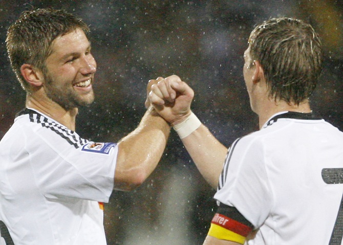 Germany's Thomas Hitzlsperger (left) and teammate Bastian Schweinsteiger