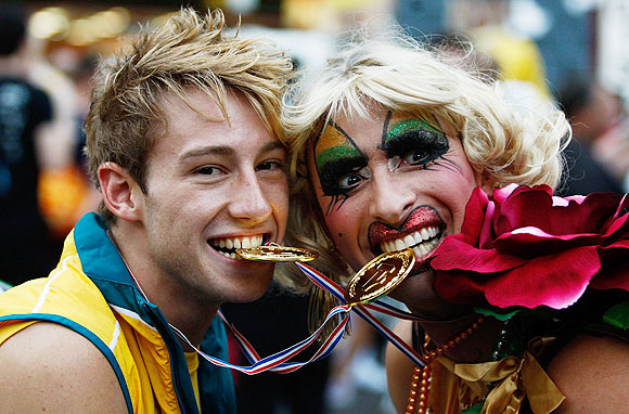 Australian Olympic gold medal winning diver Matthew Mitcham poses with Joyce Maynge