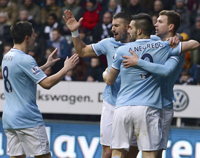 Edin Dzeko celebrates with Alvaro Negredo and Samir Nasri