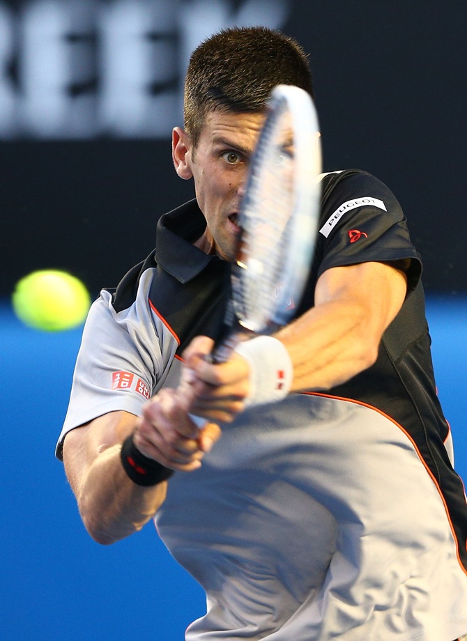 Novak Djokovic of Serbia plays a backhand in his first round match against Lukas Lacko of Slovakia at the Australian Open