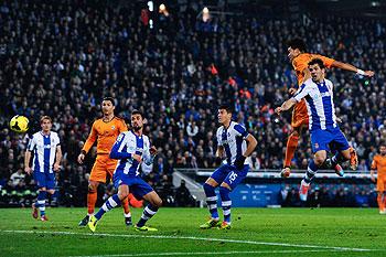 Pepe (left) of Real Madrid scores the opening goal against Espanyol during the La Liga match at Cornella-El Prat Stadium in Barcelona on Sunday