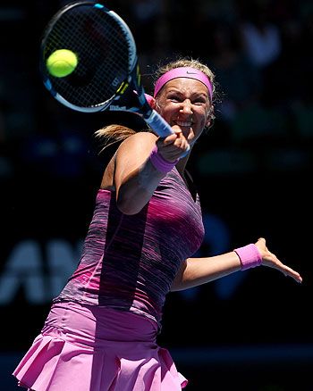 Victoria Azarenka of Belarus plays a forehand in her first round match against Johanna Larsson of Sweden at the Australian Open at Melbourne Park on Tuesday