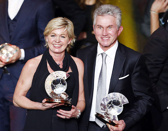 FIFA Coach of the Year Jupp Heynckes (right) poses with Women's world coach of the year Silvia Neid of the German women's national team