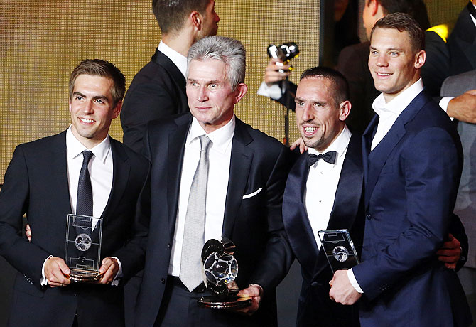 Former Bayern Munich coach Jupp Heynckes, winner of the FIFA Coach of the Year award, poses with winners of the FIFPro World XI, Bayern Munich's Philipp Lahm (left), Franck Ribery (2nd from right) and Manuel Neuer (right), on Monday
