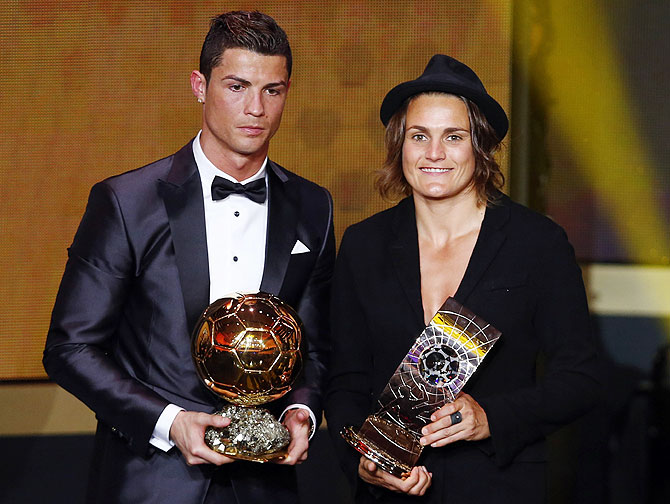 FIFA Ballon d'Or 2013 winner Cristiano Ronaldo (left) of Portugal poses with Women's World Player of the Year winner Nadine Angerer of Germany during the FIFA Ballon d'Or 2013 soccer awards ceremony in Zurich on Monday