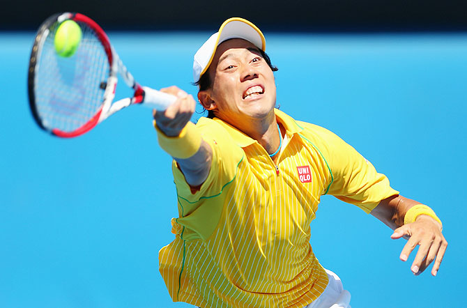 Kei Nishikori of Japan plays a forehand in his first round match against Marinko Matosevic of Australia at the Australian Open at Melbourne Park on Tuesday