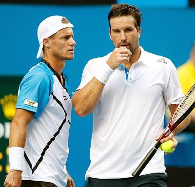 Pat Rafter (right) speaks to Lleyton Hewitt