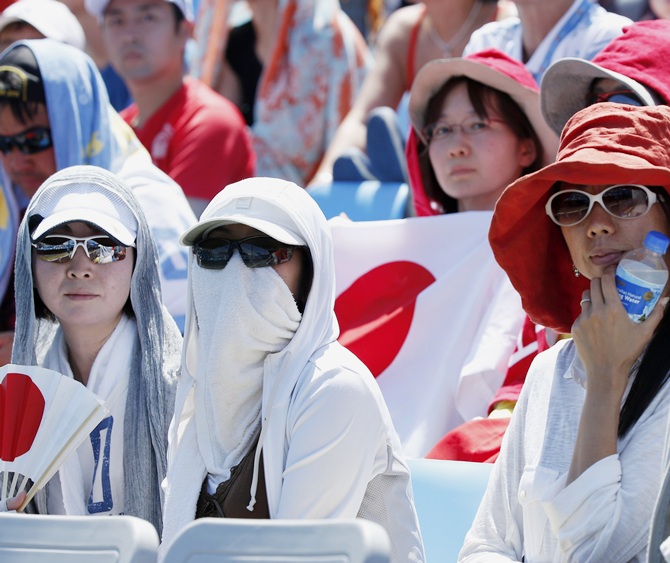 Fans watch the men's singles match between Dusan Lajovic of Serbia and Kei Nishikori of Japan at the Australian Open in Melbourne on Thursday