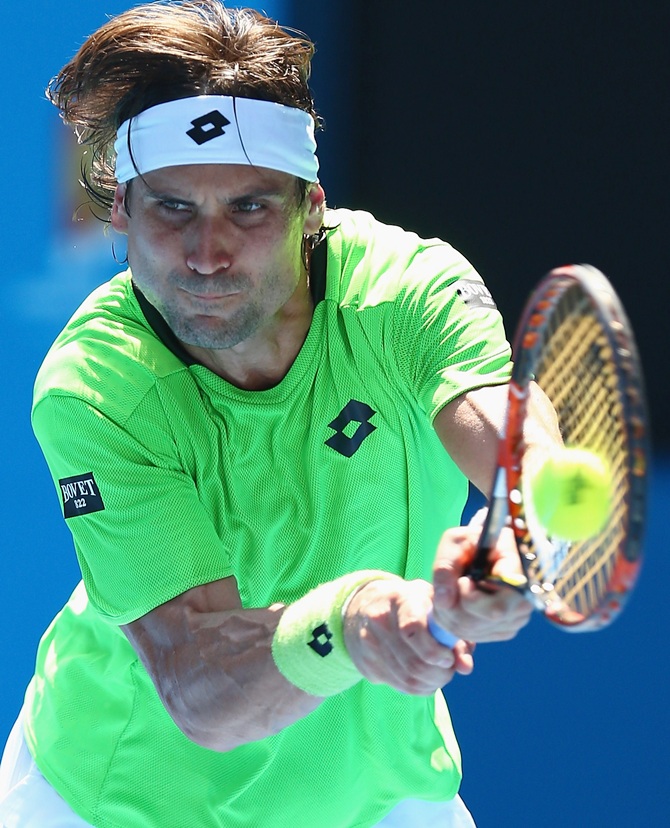 David Ferrer of Spain plays a backhand in his third round match against Jeremy Chardy
