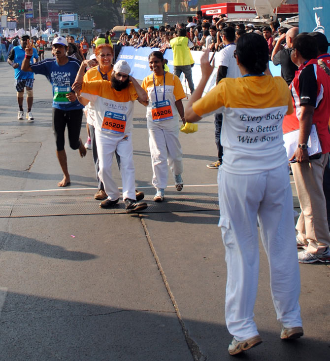 A physically challenged man enjoys his moment at the Mumbai Marathon