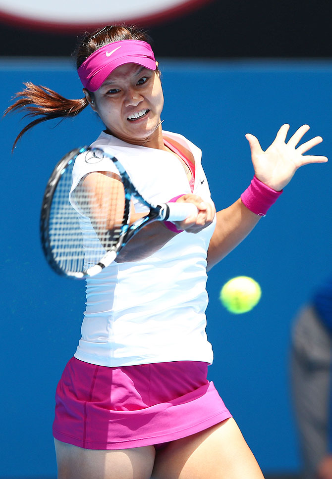 Li Na of China plays a forehand in her fourth round match against Ekaterina Makarova of Russia on Sunday