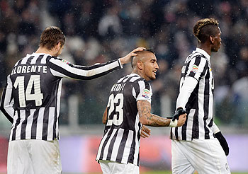 Arturo Vidal of Juventus (centre) celebrates scoring the first goal during the Serie A match between Juventus and UC Sampdoria at Juventus Arena in Turin on Saturday