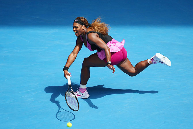 Serena Williams of the United States plays a backhand in her fourth round match against Ana Ivanovic of Serbia