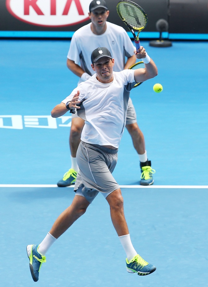 Mike Bryan and Bob Bryan of the United States in action