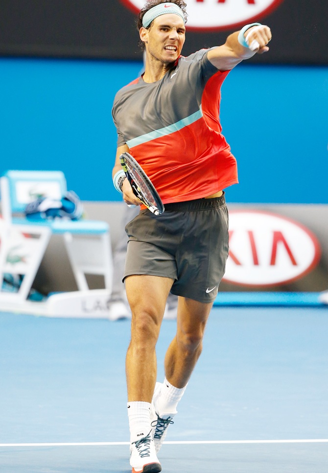 Rafael Nadal of Spain celebrates winning his fourth round match against Kei Nishikori