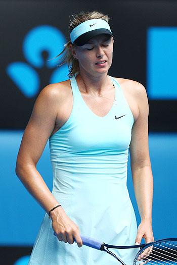 Maria Sharapova of Russia reacts to a point in her fourth round match against Dominika Cibulkova of Slovakia on Monday