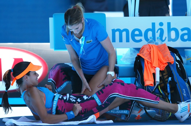 Ana Ivanovic of Serbia receives medical attention