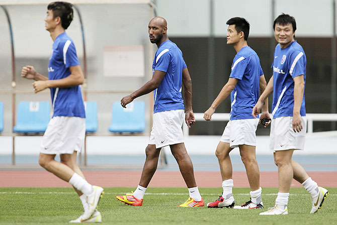 Shanghai Shenhua's Nicolas Anelka of France (2nd from left) during a training session