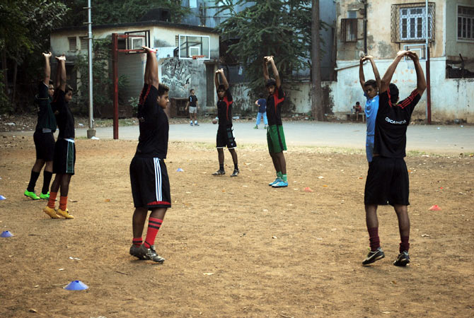 Players warm up before practice.