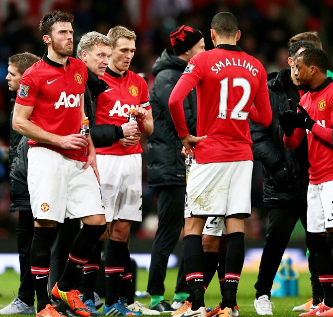 David Moyes the Manchester United manager speaks with his players