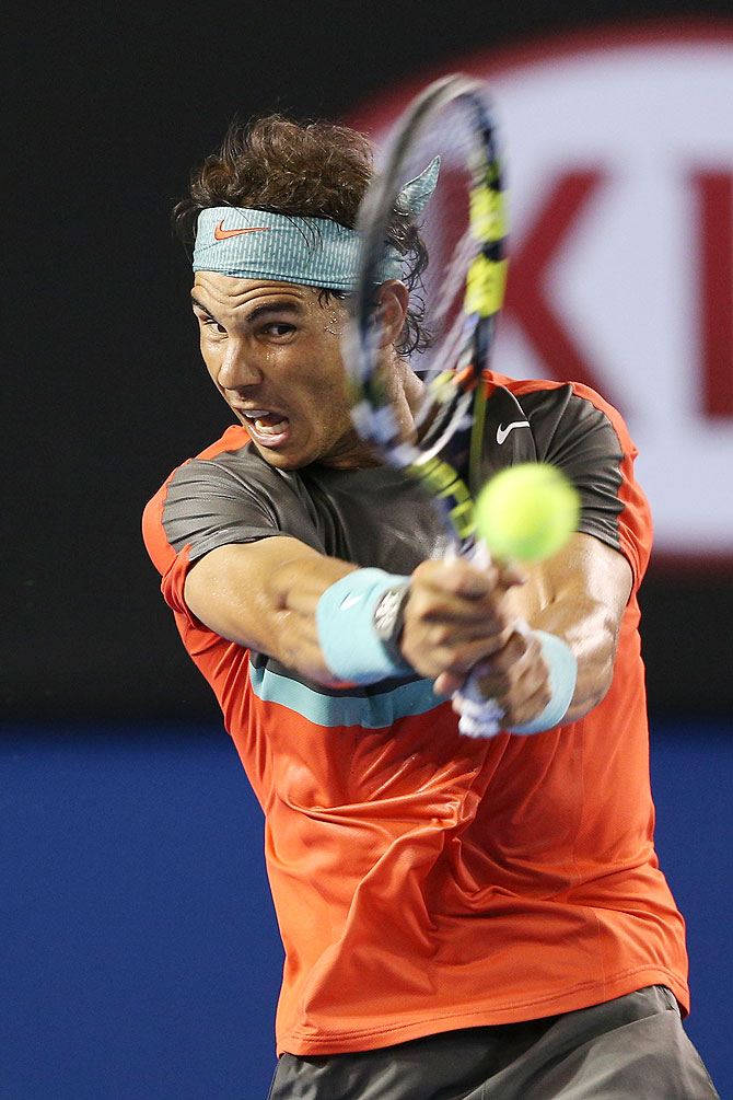 Rafael Nadal plays a backhand in his semi-final against Roger Federer on Friday