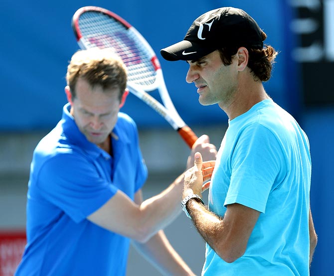 Roger Federer (right) with his coach Stefen Edberg during a training session