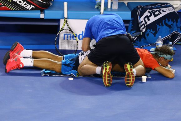 Rafael Nadal of Spain receives a back massage