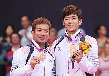 Lee Yong-dae (left) and Jae Sung Chung of Korea (L) during the 2012 London Olympics medal ceremony