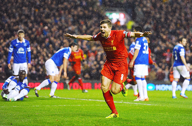 Steven Gerrard of Liverpool celebrates after scoring the opening goal against Everton