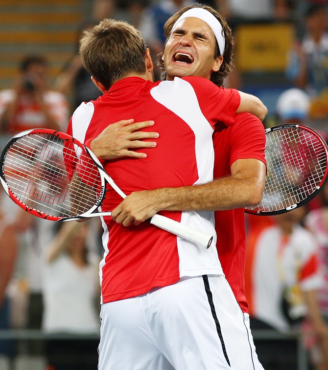 Roger Federer (right) and Stanislas Wawrinka of Switzerland celebrate
