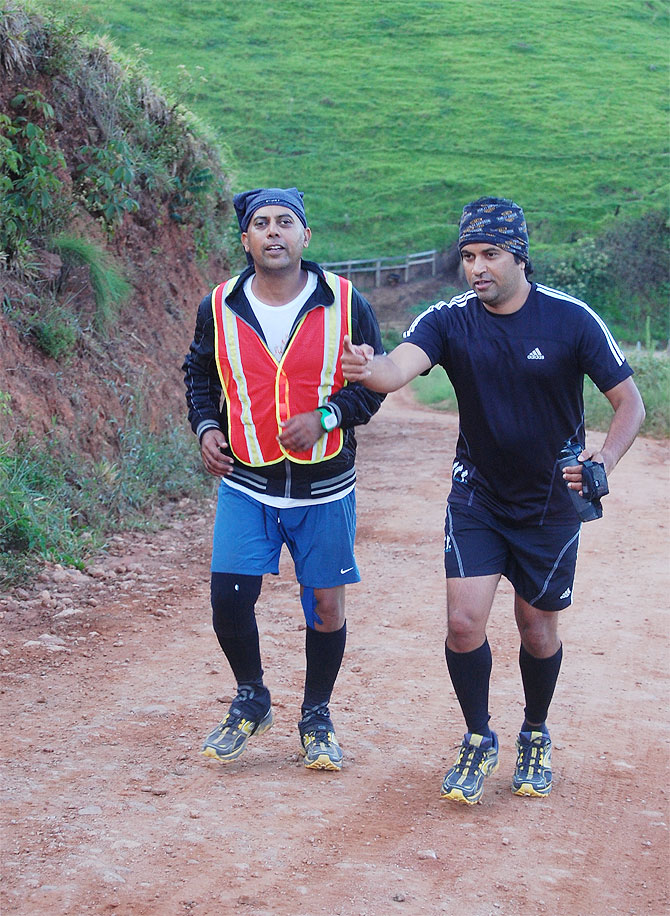 Vishwas is encouraged by one of his crew members on an uphill stretch