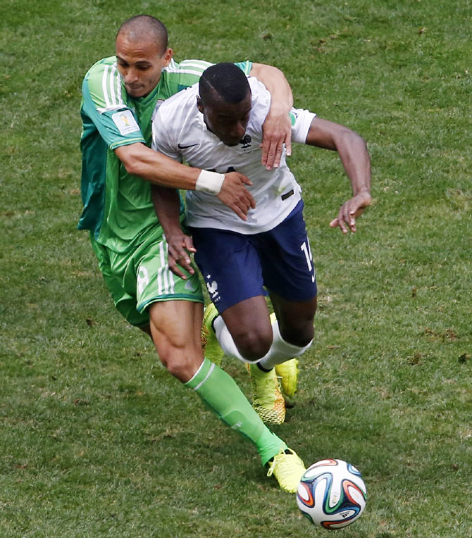 Nigeria's Peter Odemwingie (left) fights for the ball with France's Blaise Matuidi during their 2014 World Cup round of 16 game on Monday