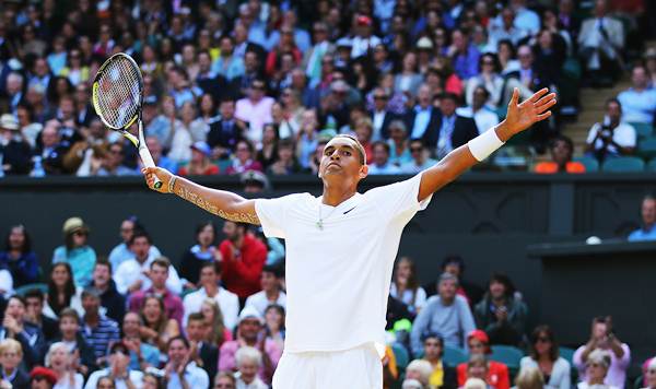 Nick Kyrgios of Australia celebrates after scoring the winning point of the match