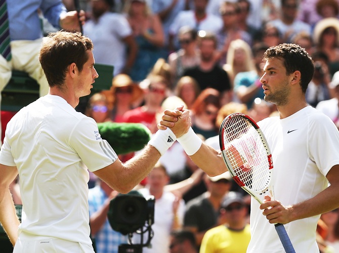 Andy Murray of Great Britain shakes hands with Grigor Dimitrov of Bulgaria after their Gentlemen's Singles quarter-final match