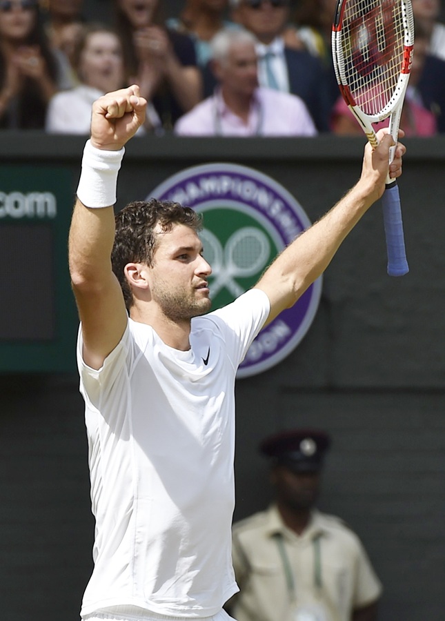 Grigor Dimitrov of Bulgaria reacts after defeating Andy Murray of Britain