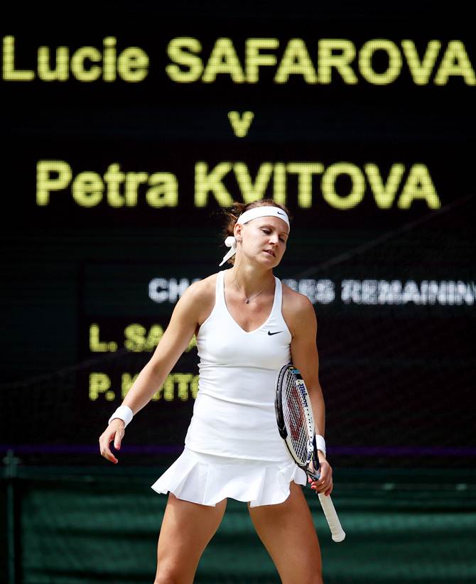 Lucie Safarova of Czech Republic stands dejected after losing to Petra Kvitova