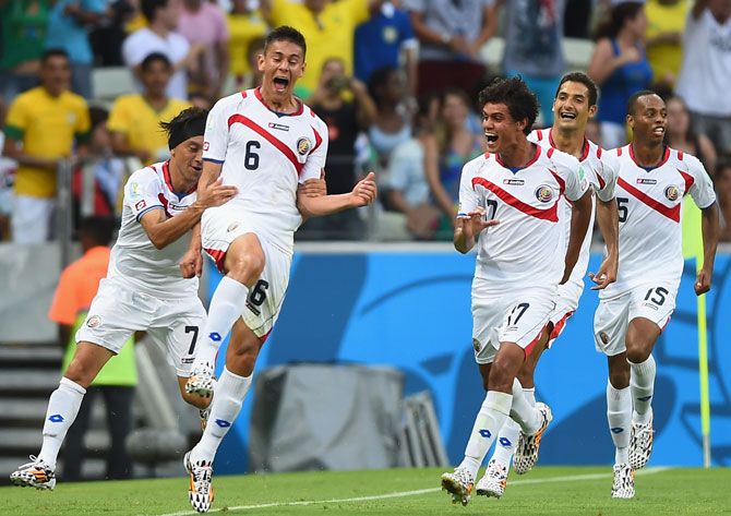 Costa Rican players celebrate a goal