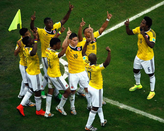Colombia's players celebrate after James Rodriguez scored the second goal against Uruguay