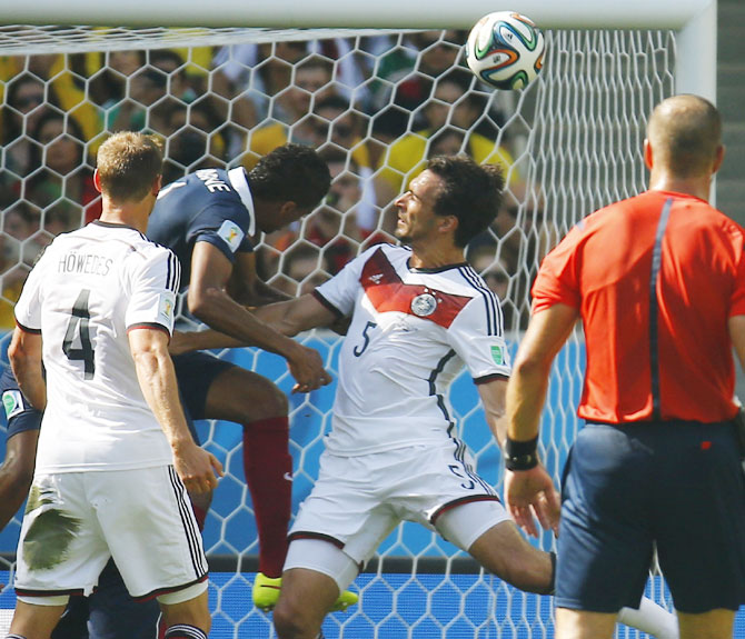 Germany's Mats Hummels (No 5) heads the ball to score the team's goal against France