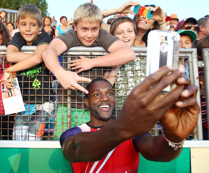 Justin Gatlin of USA celebrates with fans after winning the Men's 100m race at the IAAF Diamond League Athletics meeting 'Athletissima' in Lausanne, Switzerland, on Thursday